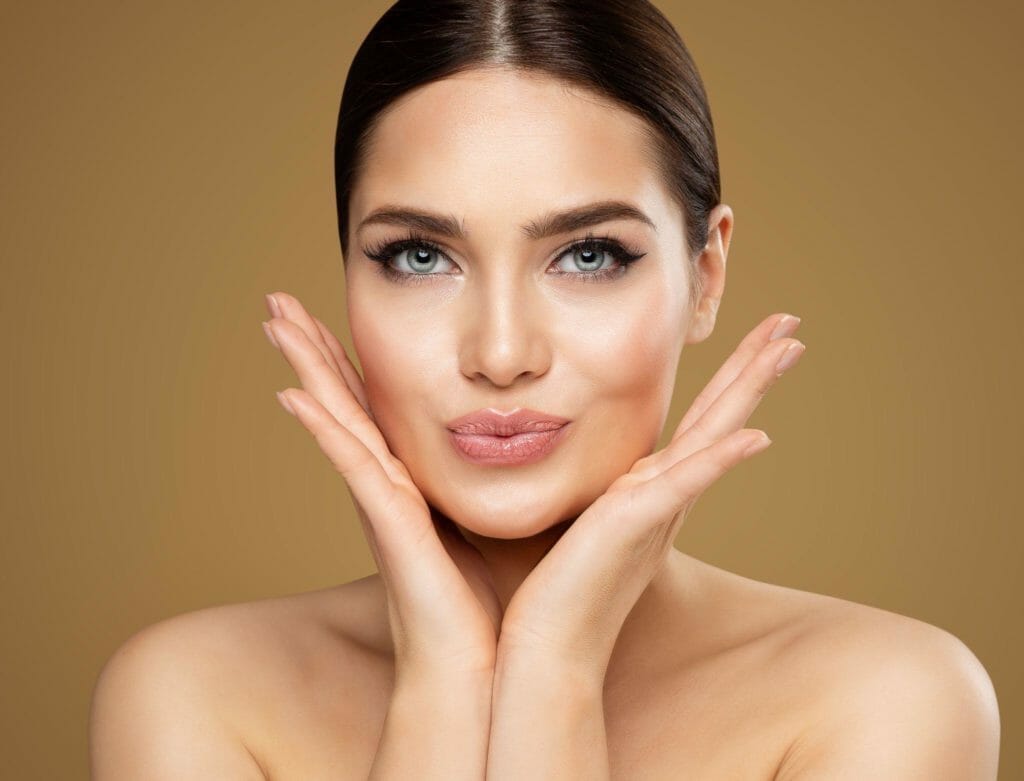 Beauty model showing cheekbones and full lips.
